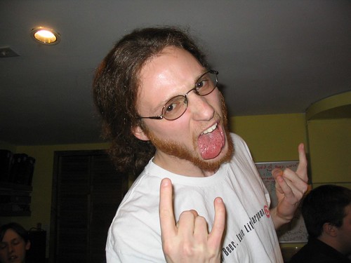 Photograph of Mike Burns doing his best metal face at the New Year's Eve Party 2004