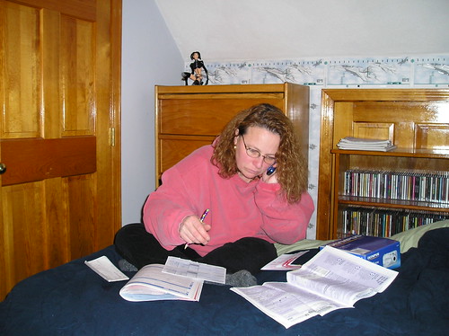 My mom doing taxes on my bed